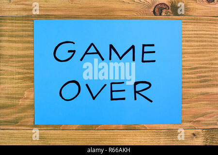 Text game over on wooden table,relationship breakup concept. Stock Photo