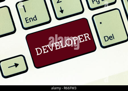Handwriting text Developer. Concept meaning demonstrating or thing that develops grows or matures something Keyboard key Intention to create computer  Stock Photo