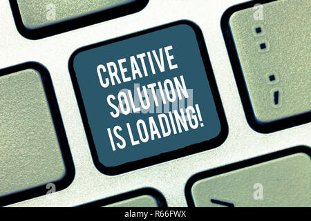 Text sign showing Creative Solution Is Loading. Conceptual photo Inspiration Original ideas in process Keyboard key Intention to create computer messa Stock Photo