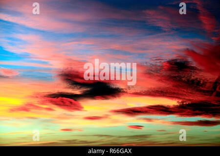 Red, pink, orange, yellow, blue, sky, cloud, clouds, evening light, warm, colour, colourful, skies, formation, formations, dramatic, England, UK Stock Photo