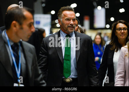 Austrian-American actor and former governor of California, Arnold Schwarzenegger seen walking as he changes rooms during the COP24 UN Climate Change Conference 2018. Stock Photo