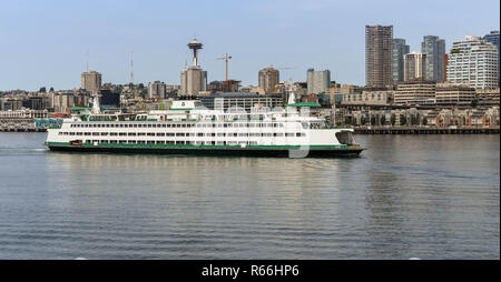 SEATTLE, WASHINGTON STATE, USA - JUNE 2018: Large car and passenger ferry arriving in Seattle after crossing Puget Sound. Stock Photo