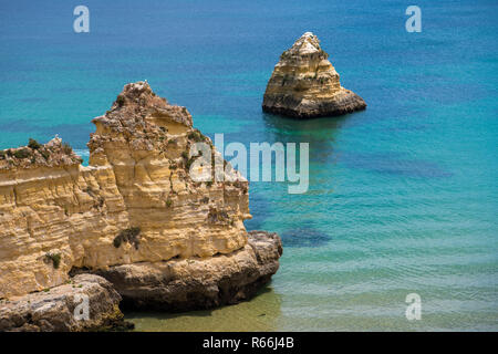 Rock formations and beautiful turquoise blue sea along Portugal's Algarve coast Stock Photo