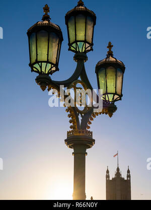 Old lamp and parliament with flag flying, London, UK. Stock Photo