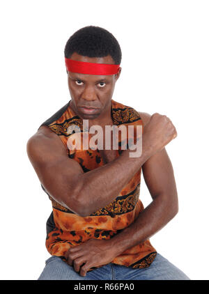 Serious looking African man in a vest Stock Photo