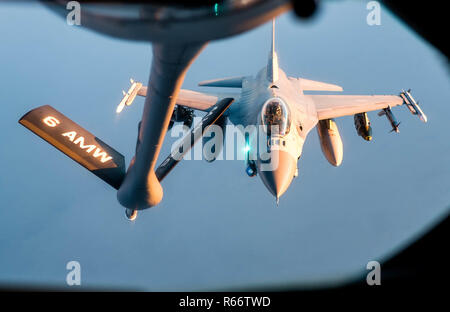 A 28th Expeditionary Aerial Refueling Squadron KC-135 Stratotanker refuels a U.S. Air Force F-16 Fighting Falcon in support of Operation Inherent Resolve, Nov. 29, 2018. The F-16 Fighting Falcon is a compact, multi-role fighter aircraft that has proven itself in air-to-air combat and air-to-surface attack. (U.S. Air Force photo by Staff Sgt. James Cason) Stock Photo