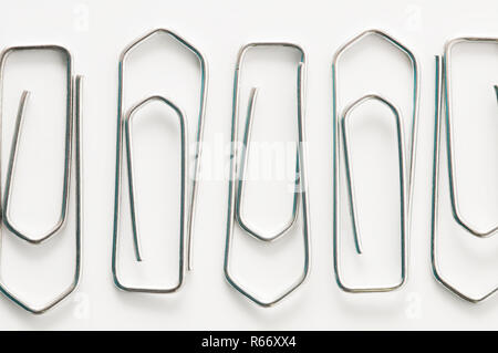 staples on a white surface Stock Photo