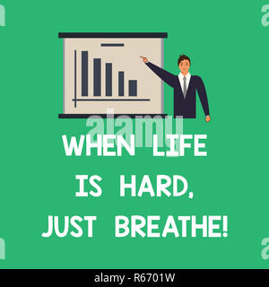 Conceptual hand writing showing When Life Is Hard Just Breathe. Business photo text Take a break to overcome difficulties Man in Business Suit Pointin Stock Photo