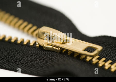 a zipper on a white surface Stock Photo