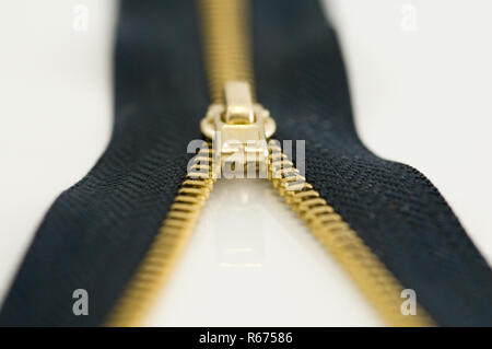 a zipper on a white surface Stock Photo