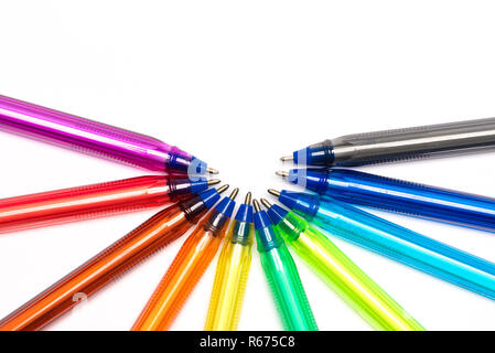 Colored plastic pens in arc on white background Stock Photo