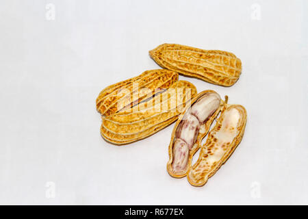 Peanuts boiled and peeled on a white background. Stock Photo