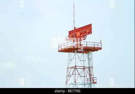 Red-and-white airport radar in daylight Stock Photo