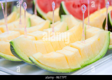 Melon sliced on a tray with a dipper. Stock Photo