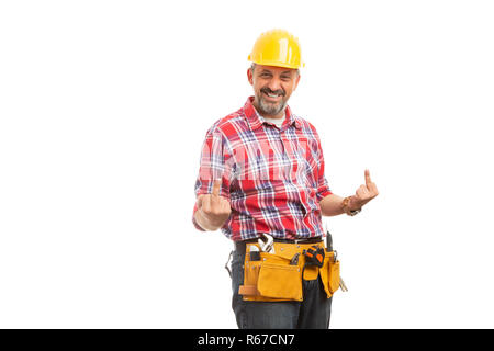 Funny constructor holding two middle fingers up with joking expression isolated on white studio background Stock Photo
