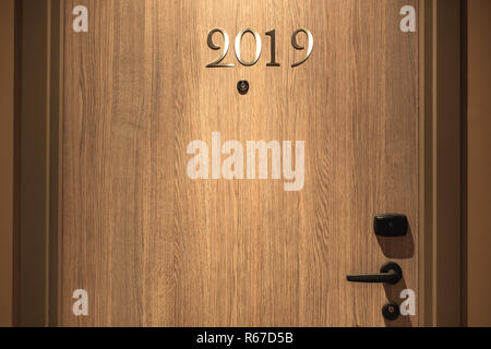 Happy New Year 2019 concept, lettering on the Hotel door. Stock Photo