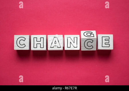 Wooden cube with word change to chance Stock Photo