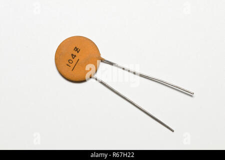 electronic capacitor on a white surface Stock Photo
