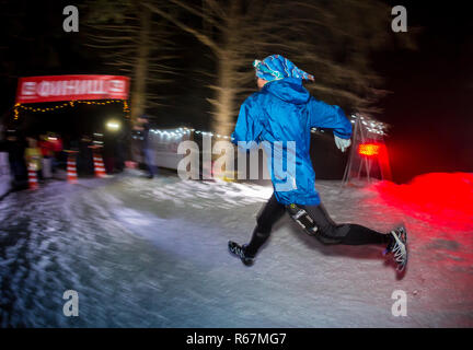 ALMATY, KAZAKHSTAN - 18 FEBRUARY 2017: Night competitions in the foothills of the city of Almaty, in the Trailrunning and Skyship discipline, which is Stock Photo