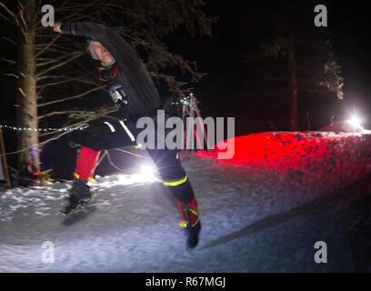 ALMATY, KAZAKHSTAN - 18 FEBRUARY 2017: Night competitions in the foothills of the city of Almaty, in the Trailrunning and Skyship discipline, which is Stock Photo