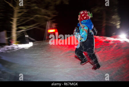 ALMATY, KAZAKHSTAN - 18 FEBRUARY 2017: Night competitions in the foothills of the city of Almaty, in the Trailrunning and Skyship discipline, which is Stock Photo