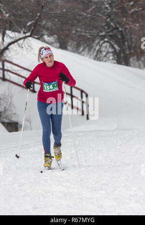ALMATY, KAZAKHSTAN - FEBRUARY 18, 2017: amateur competitions in the discipline of cross-country skiing, under the name of ARBA Ski Fest. Woman cross c Stock Photo