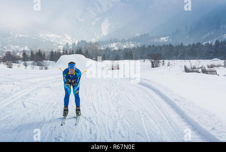 ALMATY, KAZAKHSTAN - FEBRUARY 18, 2017: amateur competitions in the discipline of cross-country skiing, under the name of ARBA Ski Fest. A man cross-c Stock Photo