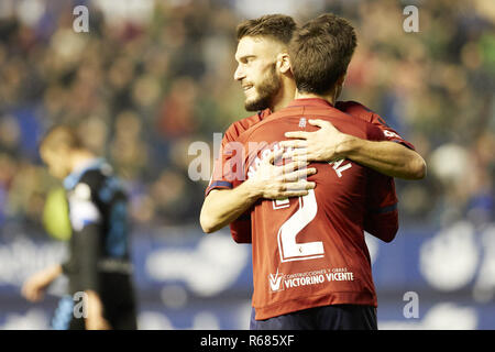 Pamplona, Navarra, Spain. 2nd Dec, 2018. Nacho Vidal (defender; CA Osasuna) and Roberto Torres (midfield; CA Osasuna) are seen embracing after the Spanish La Liga 123 football march between CA Osasuna and CD Lugo at the Sadar stadium, in Pamplona. Credit: Fernando Pidal/SOPA Images/ZUMA Wire/Alamy Live News Stock Photo