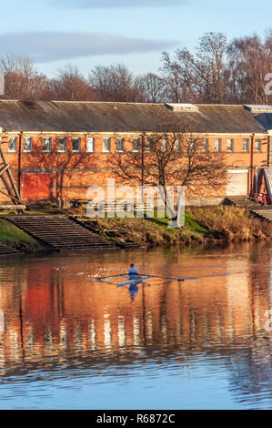 Glasgow, Scotland, UK. 4th December, 2018. UK Weather. A male rower training on a calm River Clyde on a cold, sunny afternoon. Credit: Skully/Alamy Live News Stock Photo