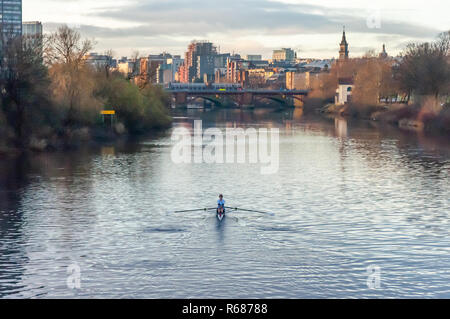 Glasgow, Scotland, UK. 4th December, 2018. UK Weather. A male rower training on a calm River Clyde on a cold, sunny afternoon. Credit: Skully/Alamy Live News Stock Photo