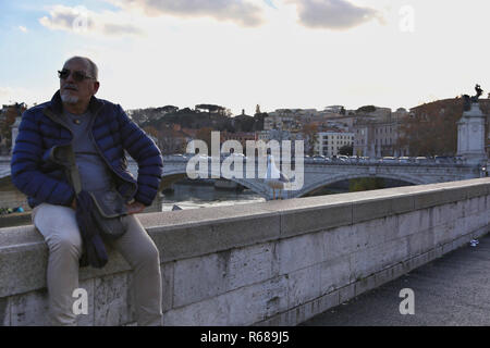 Rome, Italy. 4th Dec, 2018. A seagull stands beside a man by the Tiber River in Rome, Italy, on Dec. 4, 2018. Credit: Cheng Tingting/Xinhua/Alamy Live News Stock Photo