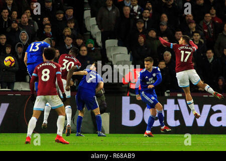London, UK. 4th Dec 2018. Michail Antonio of West Ham United (30)  heads and scores his team's third goal. Premier League match, West Ham United v Cardiff City at the London Stadium, Queen Elizabeth Olympic Park in London on Tuesday 4th December 2018.  this image may only be used for Editorial purposes. Editorial use only, license required for commercial use. No use in betting, games or a single club/league/player publications . pic by Steffan Bowen/Andrew Orchard sports photography/Alamy Live news