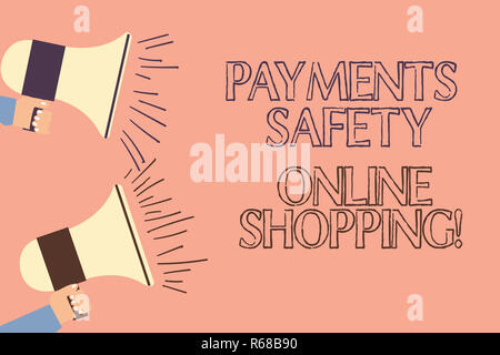 Handwriting text writing Payments Safety Online Shopping. Concept meaning Ecommerce security payment protection Two Hu analysis Hand Holding Megaphone Stock Photo