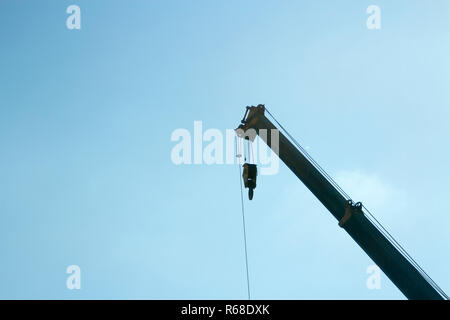 Industrial crane scale on blue sky background Stock Photo