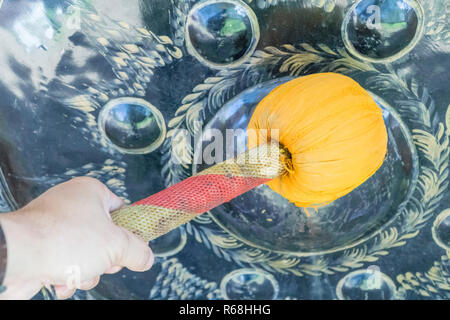 Bat of big gong black with hand Stock Photo