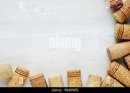 Set of used wine bottle corks, sitting on white table surface, viewed from above with copy space Stock Photo