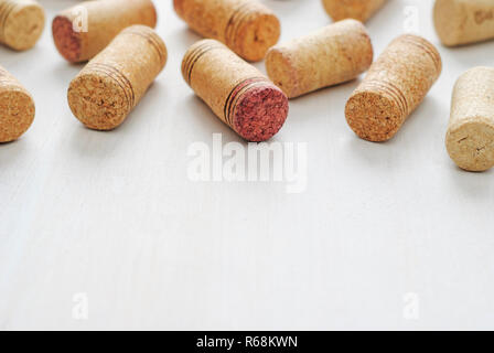 Set of used wine bottle corks, sitting on white table surface, viewed from above with copy space Stock Photo