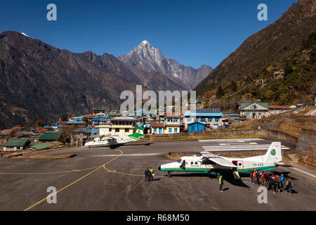 Nepal, Lukla, airport, passengers boarding Tara Air Dornier 228-212 aircraft as another takes off at world’s most dangerous airport Stock Photo