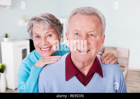 Senior Couple Enjoying Piggyback Ride Stock Photo