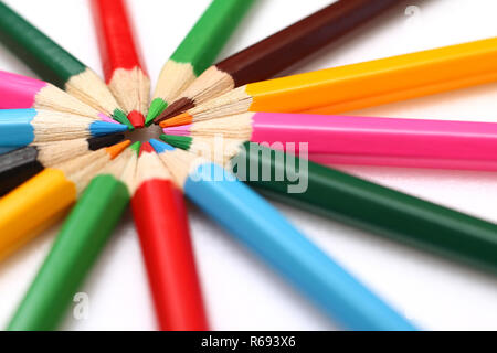 Colored pencils stacked in the form of the sun Stock Photo