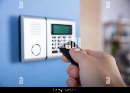 Hand Using Remote Control Stock Photo
