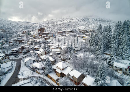 Aerial View of Seli Traditional Greek Village Covered by Snow in Winter Morning. Top Tourist Destination in Northern Greece