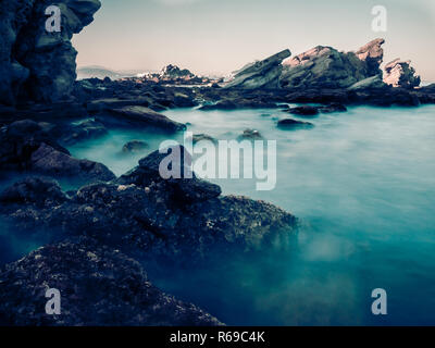 Dangerous Rocks And Motion Blurred Water In The Coast Of The Straights Of Gibraltar Near Algeciras Stock Photo