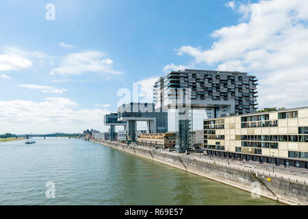 The Crane Houses On The Banks Of The Rhine And An Excursion Boat Stock Photo