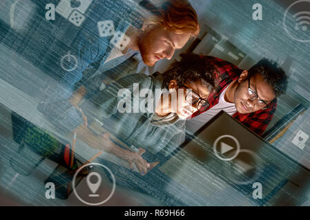 Cropped shot of multinational game developers. Team work of new game Stock Photo