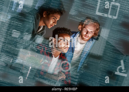 Cropped shot of young developers working overtime Stock Photo