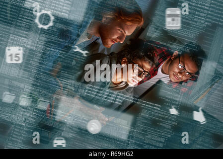 Young multinational code developers, team work of new navigation project Stock Photo