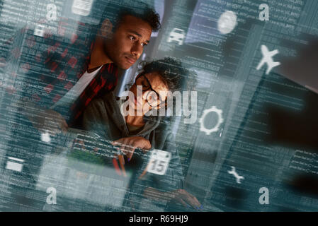 Young multinational code developers, team work of new navigation project Stock Photo