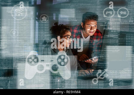 Young indian game developers thinking how to track new events Stock Photo