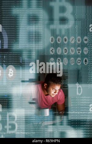 Young indian programmer thinking how to get more cryptocurrency Stock Photo